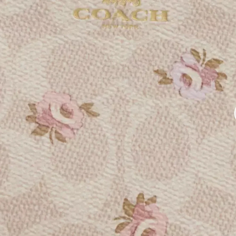 Coach Corner Zip Wristlet
In Signature Canvas With Floral Print NWT - Picture 4 of 5